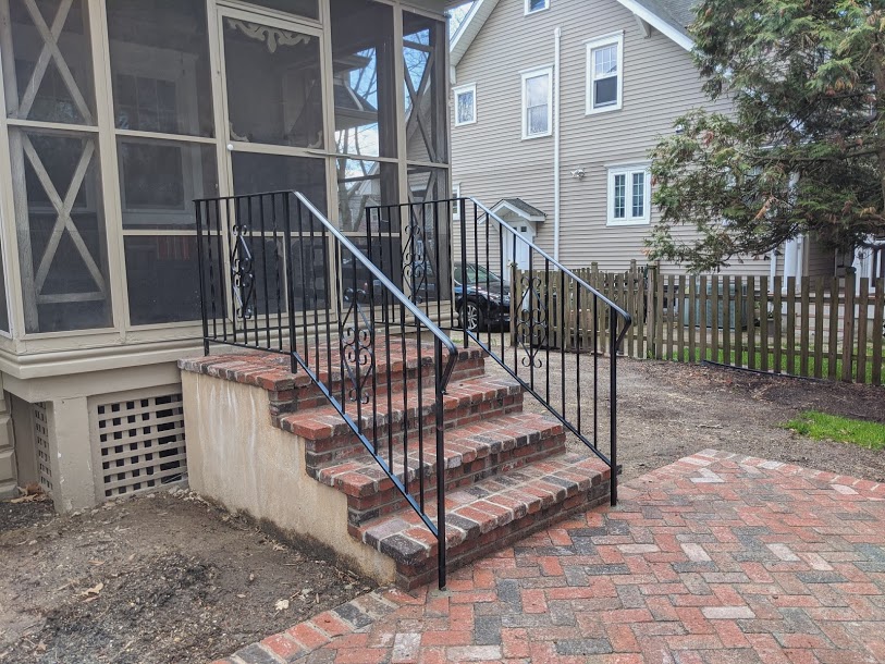 Ornamental Railing Installation on Brick Residential Stairs
